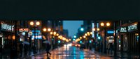 Blurred city street at night with glowing lights and wet pavement creating atmospheric urban scene for backgrounds and mood concepts.