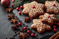 Festive gingerbread star cookies decorated with royal icing and pearl sprinkles, arranged with cranberries, star anise, and pine branches on dark background.