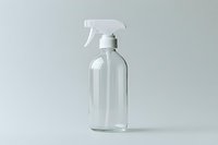 Clear glass spray bottle with trigger sprayer on minimal gray background, empty container ready for cleaning products or cosmetic solutions.