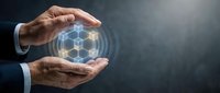 Businessman hands protecting glowing hexagonal network structure representing digital technology, cybersecurity and data protection in modern business environment.