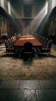 Grand dining hall with long wooden table, ornate chairs, and dramatic light rays streaming through windows, featuring classical architecture, tapestries, and stone flooring for luxury interior design.
