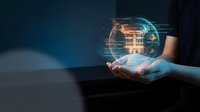 Person in dark clothing holding glowing digital globe with holographic data visualization and network connections, representing global technology, innovation, and digital transformation for business solutions.