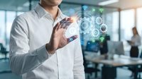 Professional businessman touching digital holographic interface with network connectivity icons in modern office environment for technology presentations.