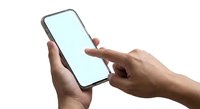 Hands holding smartphone with blank screen for mockup and app presentation on white background.