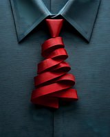 Creative red ribbon Christmas tree necktie on business shirt collar for holiday corporate fashion and festive professional attire concepts.