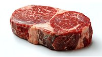 Fresh raw ribeye steak with marbling pattern on white background, premium cut of beef meat showing characteristic fat distribution and deep red color.
