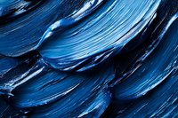 Abstract blue paint strokes with thick impasto texture creating dynamic flowing patterns for modern art and creative design projects.