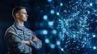 Military serviceman in combat uniform standing against digital network visualization background with glowing blue nodes and connections. Technology concept.