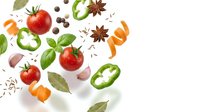 Fresh vegetables and spices floating on white background with tomatoes, bell peppers, basil leaves, garlic and star anise for culinary design projects.