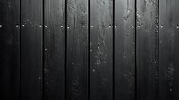 Dark wooden planks with peeling paint and weathered texture create dramatic vertical lines and shadows, suitable for rustic or industrial design backgrounds.