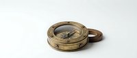 Vintage brass compass with wooden handle isolated on white background, ready for design projects, educational materials, and nautical-themed compositions.