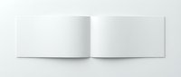 Open blank white booklet or brochure mockup with clean pages spread flat on white surface for design presentation and marketing materials.