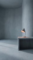 Minimalist concrete interior space with desk lamp on geometric table, modern industrial design for contemporary workspace and architectural visualization projects.