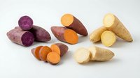Colorful sweet potato varieties including purple, orange and white types sliced to show vibrant flesh colors on white background for healthy cooking recipes.