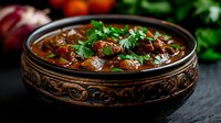 Hearty bean stew with herbs in ornate ceramic bowl, rustic comfort food perfect for restaurant menus and culinary blogs.