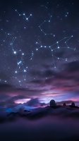 Night sky with constellation patterns connected by glowing lines above purple twilight clouds and silhouetted observatory domes for astronomy education.