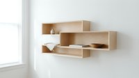 Modern wooden floating shelves with geometric design displaying minimalist decor items against white wall in contemporary interior space.