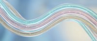 Abstract flowing wave with pastel rainbow colors and sparkles on soft gradient background for modern design projects and digital art presentations.