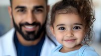 Middle Eastern father and young daughter with curly hair share tender moment together, smiling at camera. Close up portrait showing family bonding and paternal love.