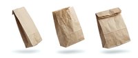Crumpled kraft paper bags in various folded positions, suitable for packaging, branding mockups, and retail design projects.