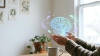 Hands holding glowing neon brain hologram with neural network connections, representing artificial intelligence, innovation, and digital technology for business and education concepts.