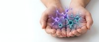 Hands holding colorful origami paper stars in purple and teal colors against white background for crafting and decoration projects.