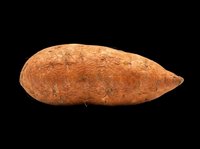 Whole sweet potato isolated on transparent background, ready for culinary, nutrition, and food design projects including print-on-demand, t-shirt graphics, and digital marketing materials.