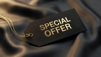 Luxury black price tag with gold special offer text on elegant dark silk fabric background for retail and marketing.