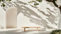 Minimalist outdoor scene with wooden bench against white Mediterranean wall, natural leaf shadows creating organic patterns, sunlit architectural detail.