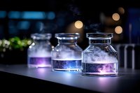Mystical glowing glass bottles with purple and blue smoke effects against dark background with bokeh lights create magical laboratory atmosphere.