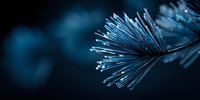 Fiber optic cables with glowing light transmission ends creating abstract technology network communication concept on dark blue background.