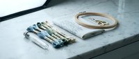 Medical surgical instruments set with scalpels, forceps and clamps on sterile table for healthcare procedures and operations.