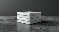 Stack of elegant white gift boxes or product packaging on dark textured surface against gray background, perfect for luxury retail and branding presentations.