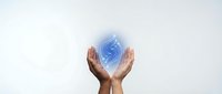 Hands holding glowing blue digital globe symbol, representing global connectivity, technology innovation, and worldwide business communication solutions.