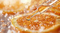 Dropper with essential oil dripping onto fresh orange slice with water splashes and bokeh lights in warm golden tones, macro photography for wellness and aromatherapy.