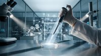 Scientist in protective gloves conducting laboratory research with digital data visualization in modern scientific facility for medical analysis.