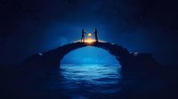 Silhouettes of two people standing on stone bridge arch over ocean at night with glowing lantern between them against starry sky and moonlit water.