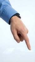 Male hand in blue shirt sleeve pointing finger downward with black watch on white background isolated for business presentations and design projects.