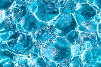 Turquoise water surface with bubbles and ripples creating abstract pattern. Dynamic liquid texture with light reflections and transparent aqua formations.