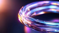 Glowing spiral light trails in blue and pink neon colors against dark background create dynamic motion effect, suitable for technology and innovation concepts.