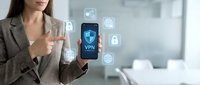 Professional businesswoman using smartphone with VPN security icons and digital privacy symbols in modern office environment for cybersecurity protection.