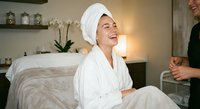 Young woman in white bathrobe and towel relaxing at luxury spa treatment room, wellness and self-care lifestyle concept for beauty salon services.