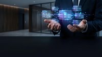 Businessman hands presenting holographic digital interface with colorful data blocks in modern office environment for technology presentations.