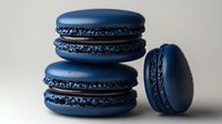 Elegant navy blue macarons with smooth shells and delicate feet, perfect for luxury dessert photography and culinary branding projects.