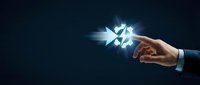 Businessman hand holding glowing diamond crystal with bright light rays on dark background, representing wealth, luxury, success, and valuable business opportunities.