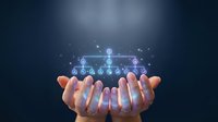 Hands presenting glowing digital network diagram with connected nodes and data flow visualization for business technology and connectivity concepts.