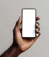Black male hand holding smartphone with blank white screen against neutral gray background. Perfect for app mockups and digital presentations.