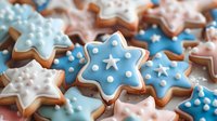 Festive star-shaped sugar cookies decorated with blue and white royal icing, polka dots and star details create winter holiday atmosphere for seasonal baking.