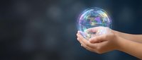 Hands holding glowing holographic Earth globe with rainbow colors against dark background. Environmental protection and global sustainability concept.