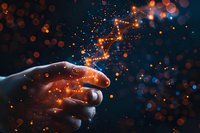 Magical touch with glowing orange and blue particles streaming between fingers against dark background, creating ethereal light trail effect and bokeh.